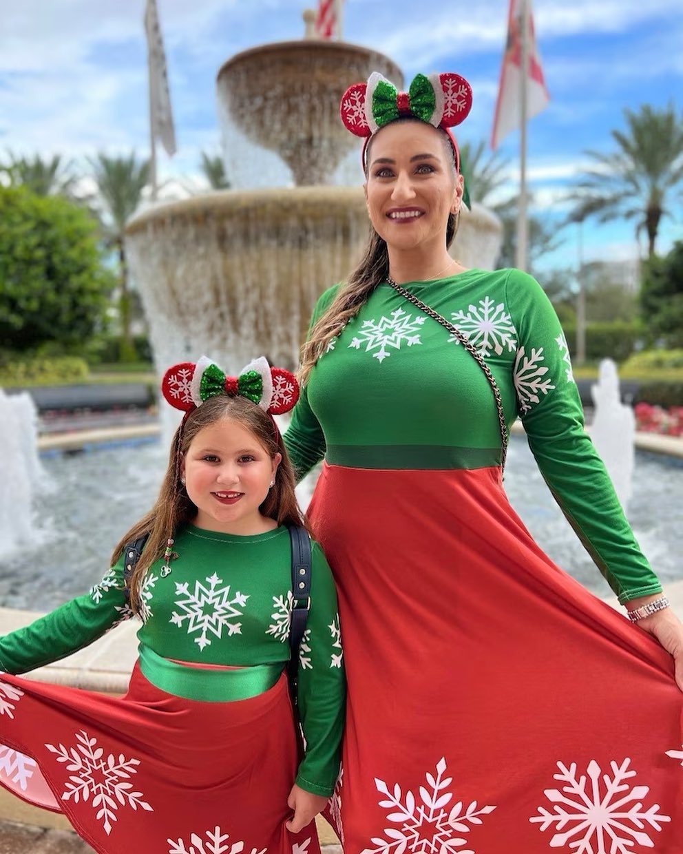Two models share their Very Merry Christmas dresses, the perfect way to dress like a holiday Minnie to get into the party spirit. 