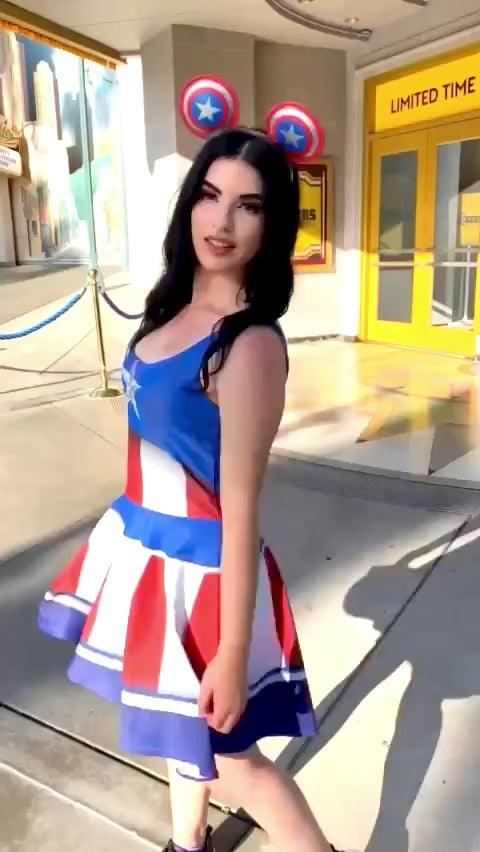 Our model stands outside of the Rogers musical at Disney's California Adventure park wearing a style inspired by Captain Rogers, or Captain America, himself! The dress is a fun red white and blue and makes for great disneybounding, cosplay or an easy all day costume. 