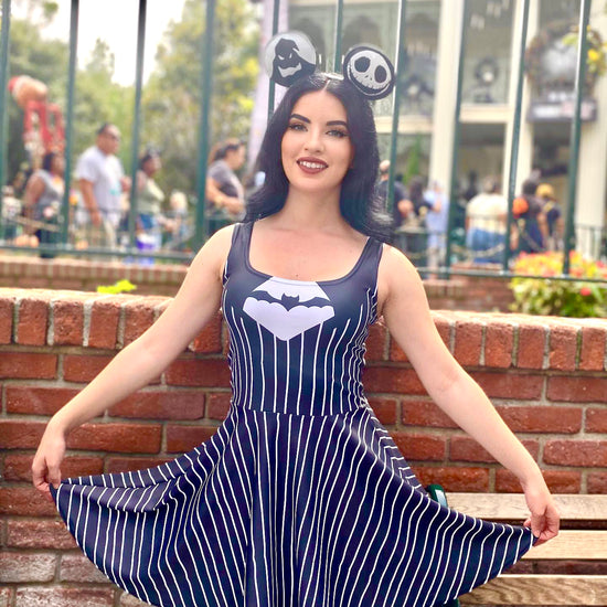 Our model stands outside of the haunted mansion holiday attraction showing off her jack skellington dress while at Disneyland.